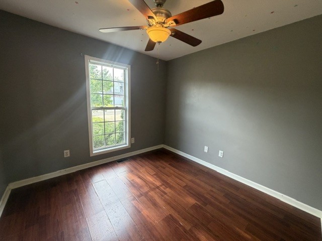 515 Preakness Circle Pleasant View, TN 37146 - Photo 9 of 13 an empty room with windows and fan