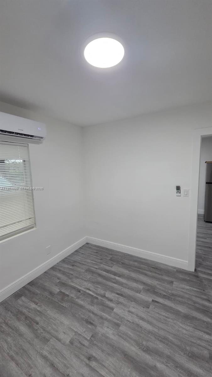 855 Northwest 3rd Terrace, Unit 2 Dania Beach, FL 33004 - Photo 6 of 8 wooden floor in an empty room