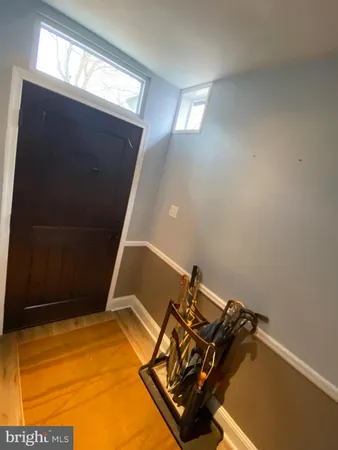 a view of a room with rack and wooden floor