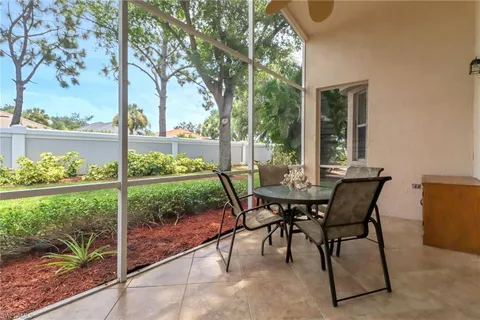 a view of a patio with table and chairs and potted plants