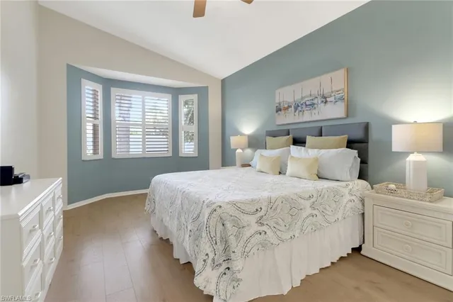 a bedroom with bed and a window