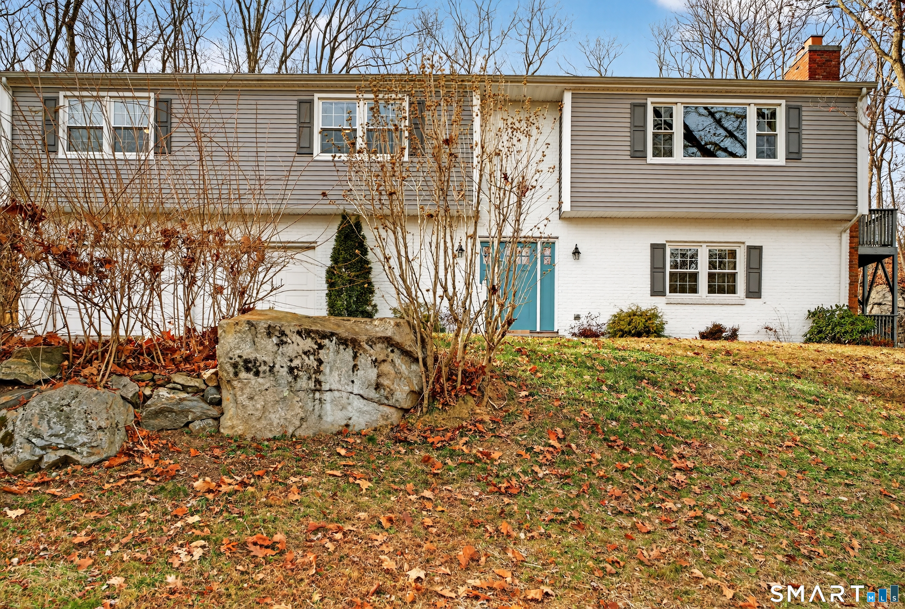 front view of a house with a yard
