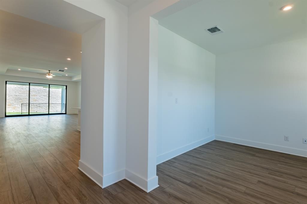 4612 Modena Bay Bend Leander, TX 78641 - Photo 4 of 34 Unfurnished room featuring recessed lighting, dark wood-style floors, and ceiling fan