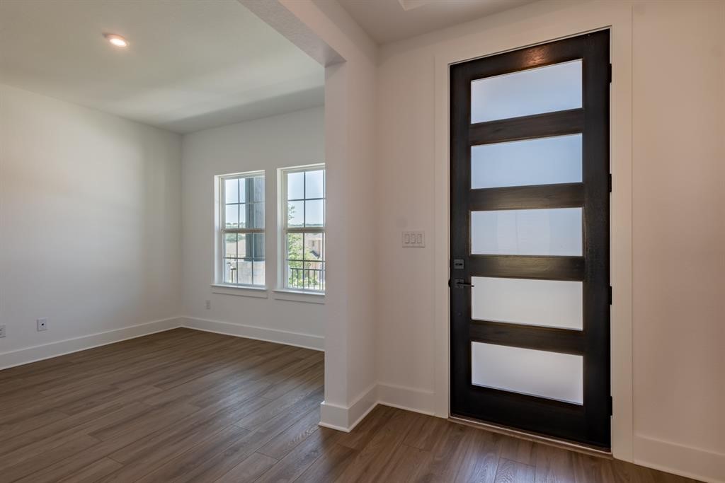 4612 Modena Bay Bend Leander, TX 78641 - Photo 5 of 34 Entryway featuring dark wood-type flooring and recessed lighting
