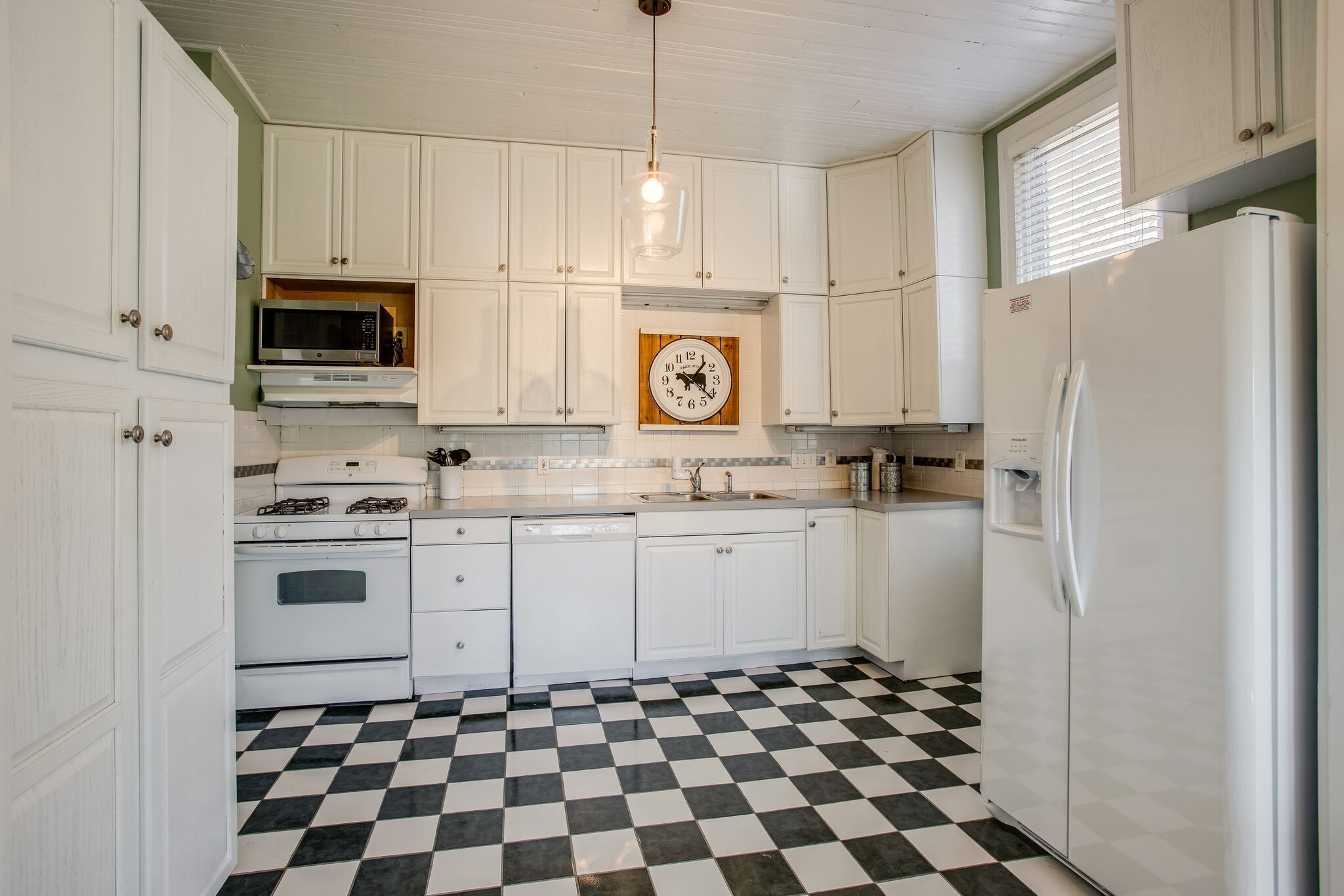 959 Glass Street Franklin, TN 37064 - Photo 13 of 19 a kitchen with granite countertop white cabinets and stainless steel appliances
