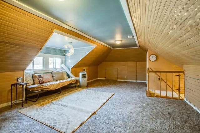 a view of an empty room with windows