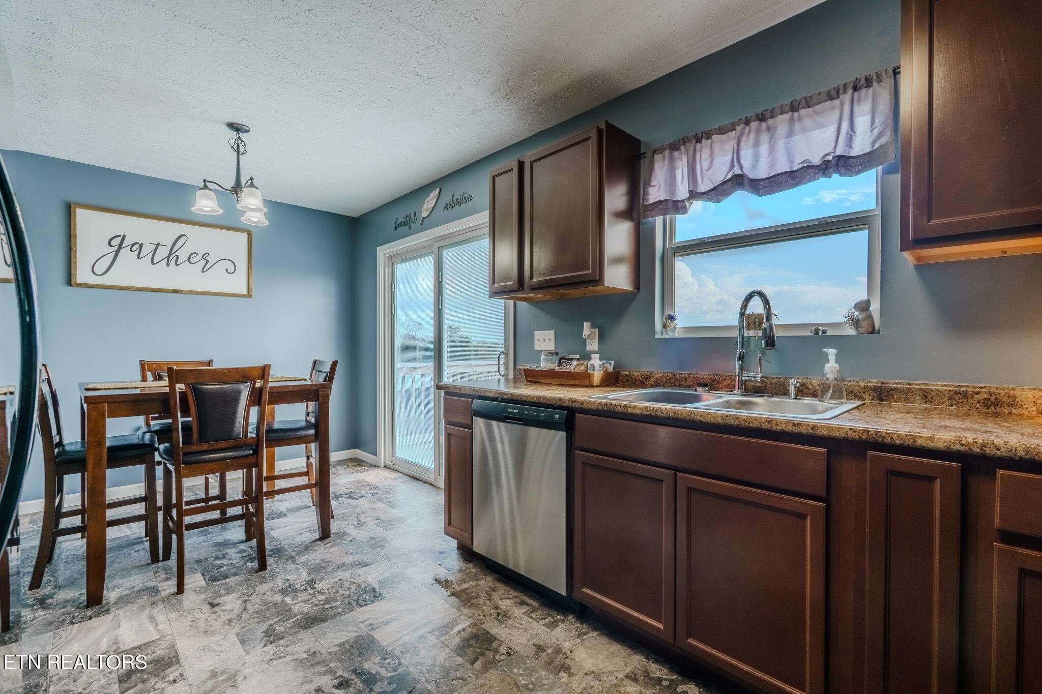 3215 Smith Road White Pine, TN 37890 - Photo 13 of 28 a kitchen with kitchen island granite countertop wooden cabinets and a sink