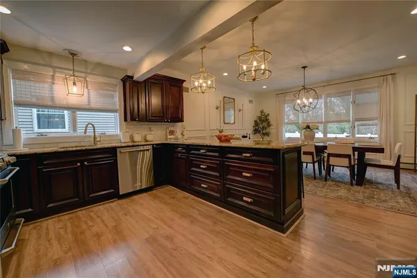 a living room with furniture and a flat tv screen