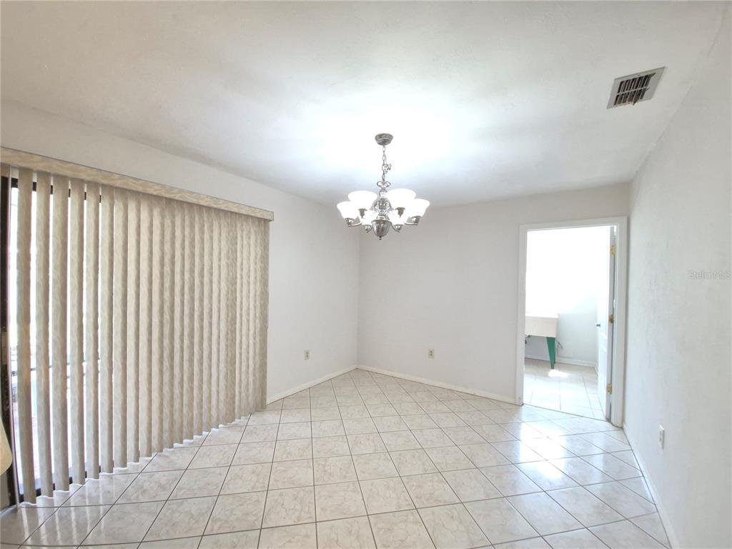 25632 Southwest 19 Avenue Newberry, FL 32669 - Photo 7 of 20 a view of an empty room with a window