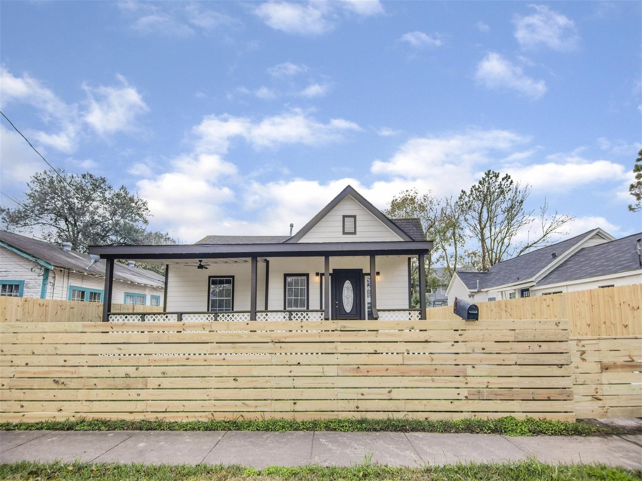 5108 Clay Street Houston, TX 77023 - Photo 1 of 21 a front view of a house with a garden