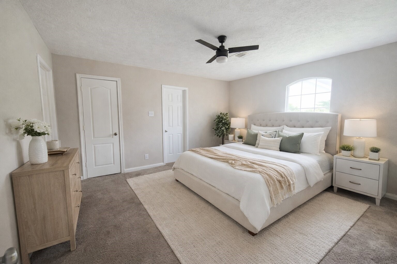 5108 Clay Street Houston, TX 77023 - Photo 14 of 21 a spacious bedroom with a bed and a chandelier