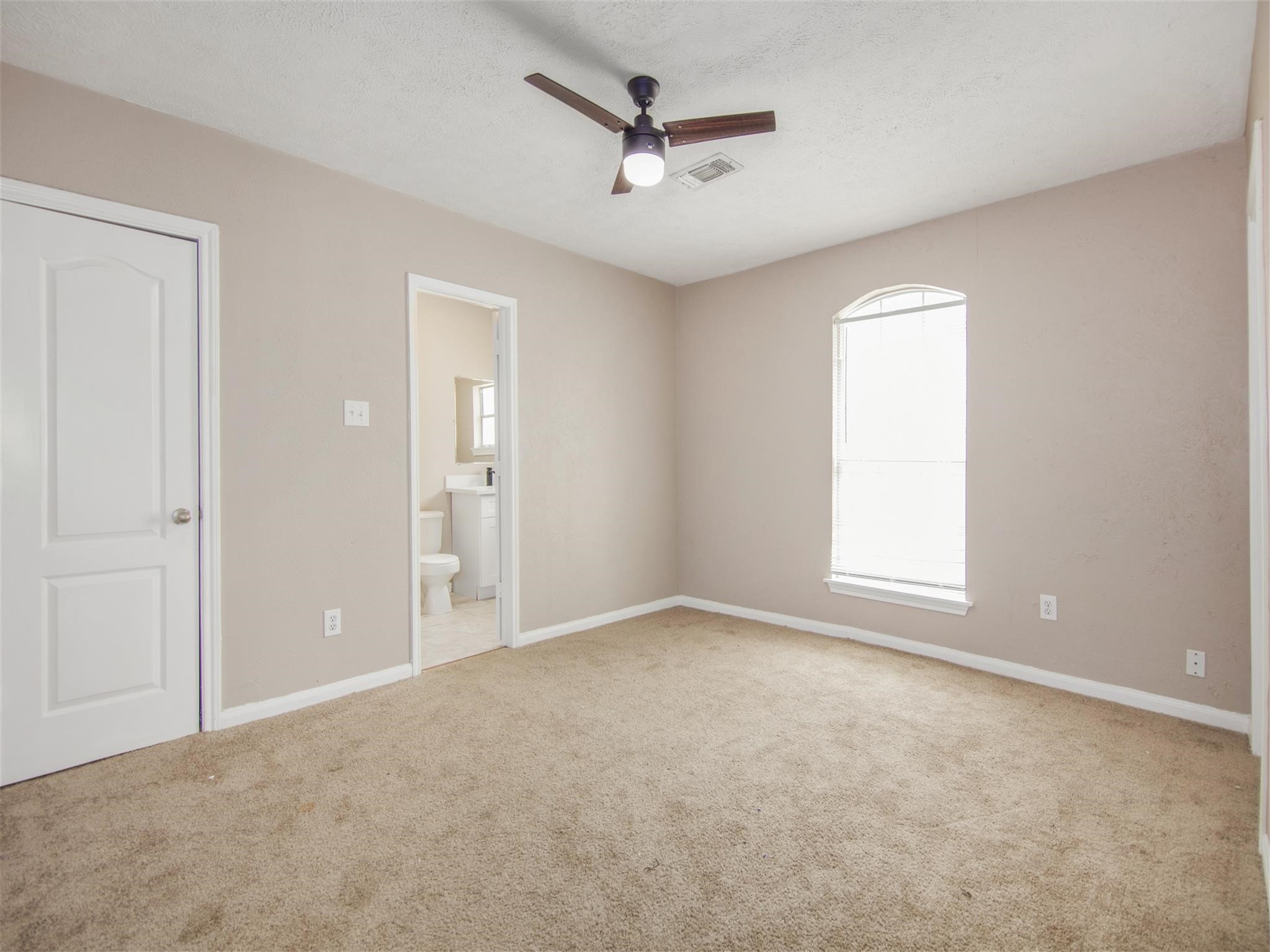 5108 Clay Street Houston, TX 77023 - Photo 15 of 21 an empty room with fan and windows