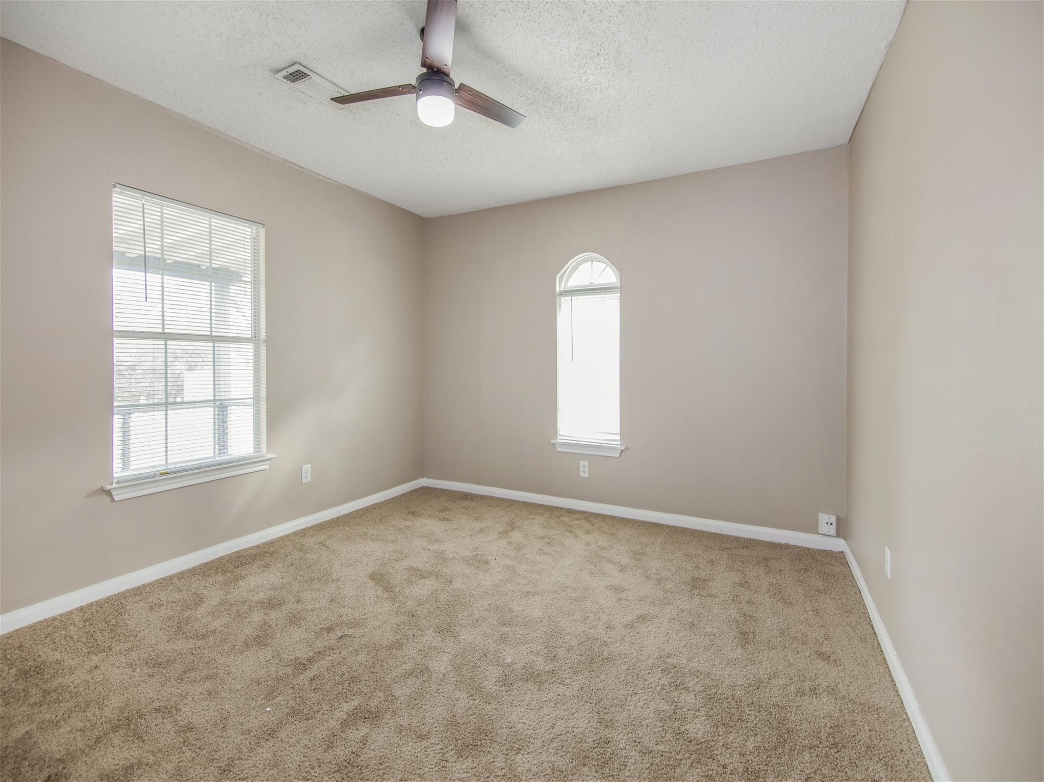 5108 Clay Street Houston, TX 77023 - Photo 16 of 21 an empty room with a empty space and windows