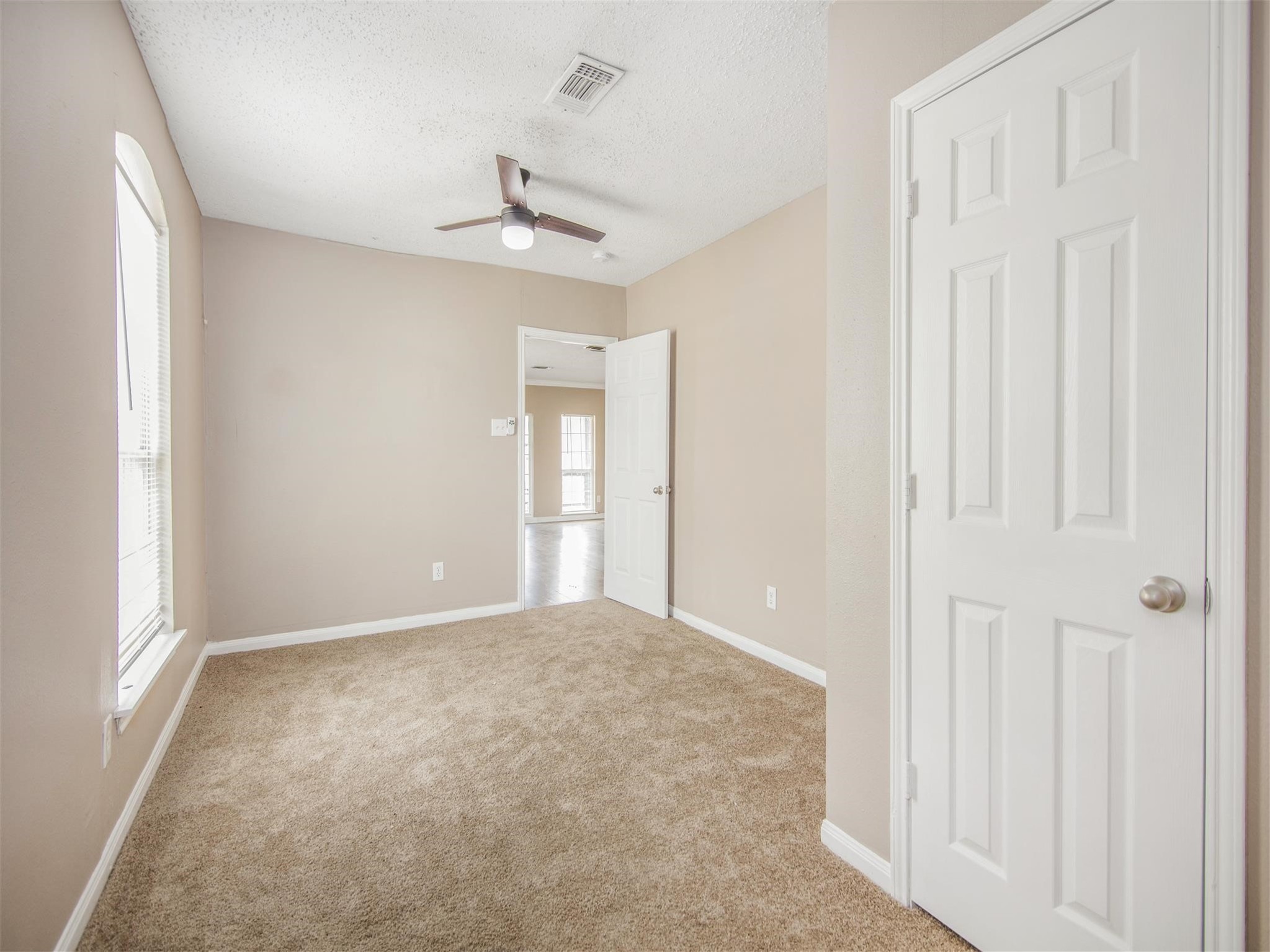 5108 Clay Street Houston, TX 77023 - Photo 18 of 21 a view of an empty room with a window
