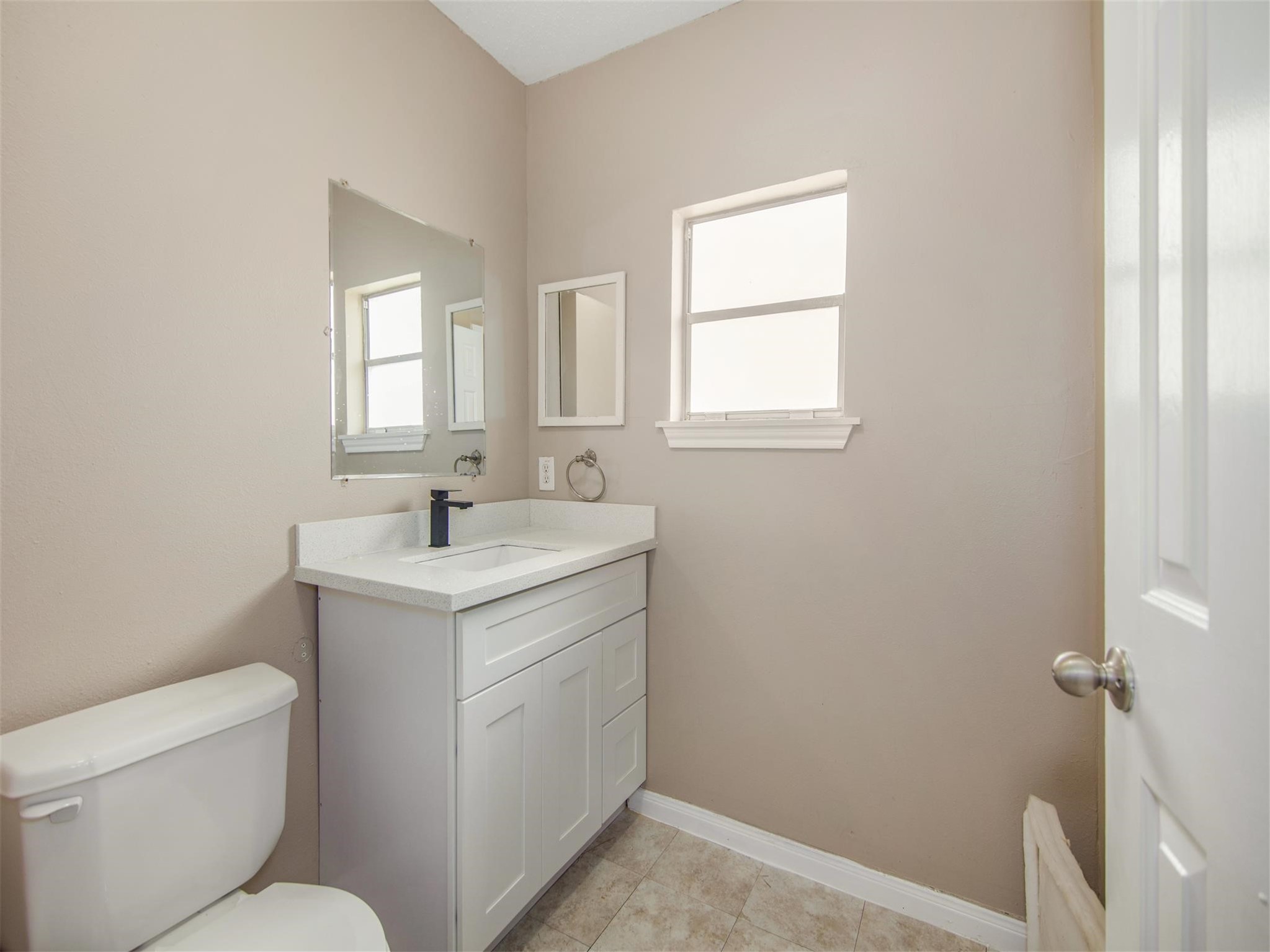 5108 Clay Street Houston, TX 77023 - Photo 19 of 21 a bathroom with a sink toilet and vanity