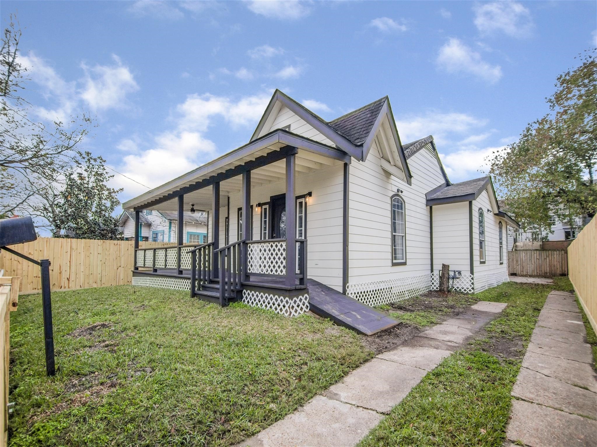 5108 Clay Street Houston, TX 77023 - Photo 2 of 21 a view of a house with a yard and pathway