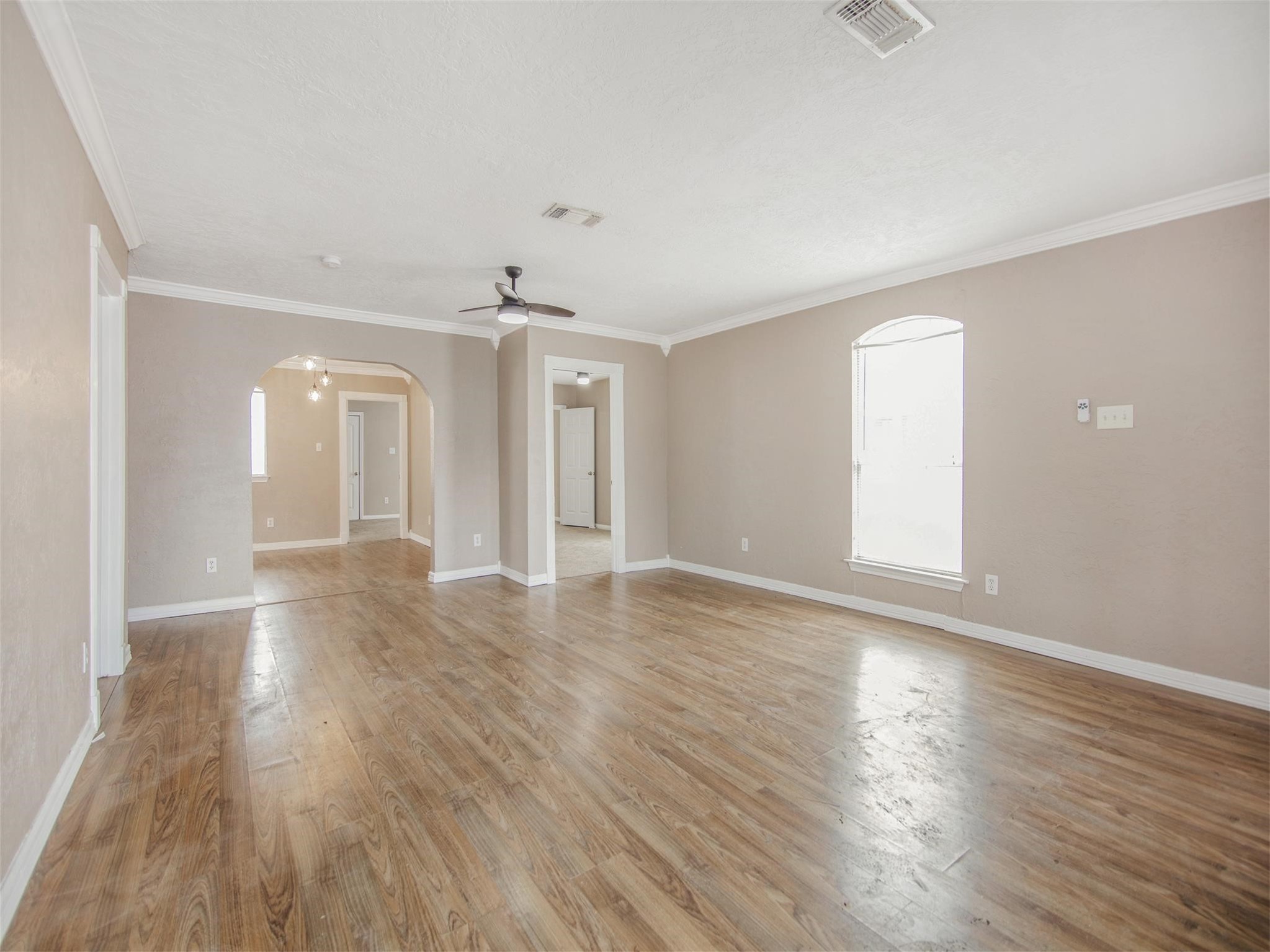 5108 Clay Street Houston, TX 77023 - Photo 8 of 21 an empty room with wooden floor and windows