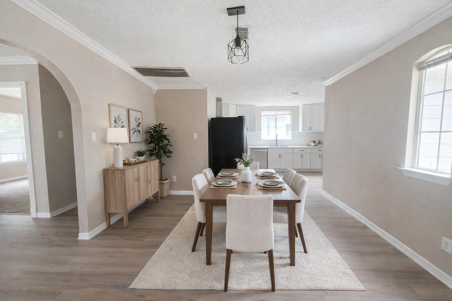 5108 Clay Street Houston, TX 77023 - Photo 9 of 21 a view of a dining room with furniture window and wooden floor