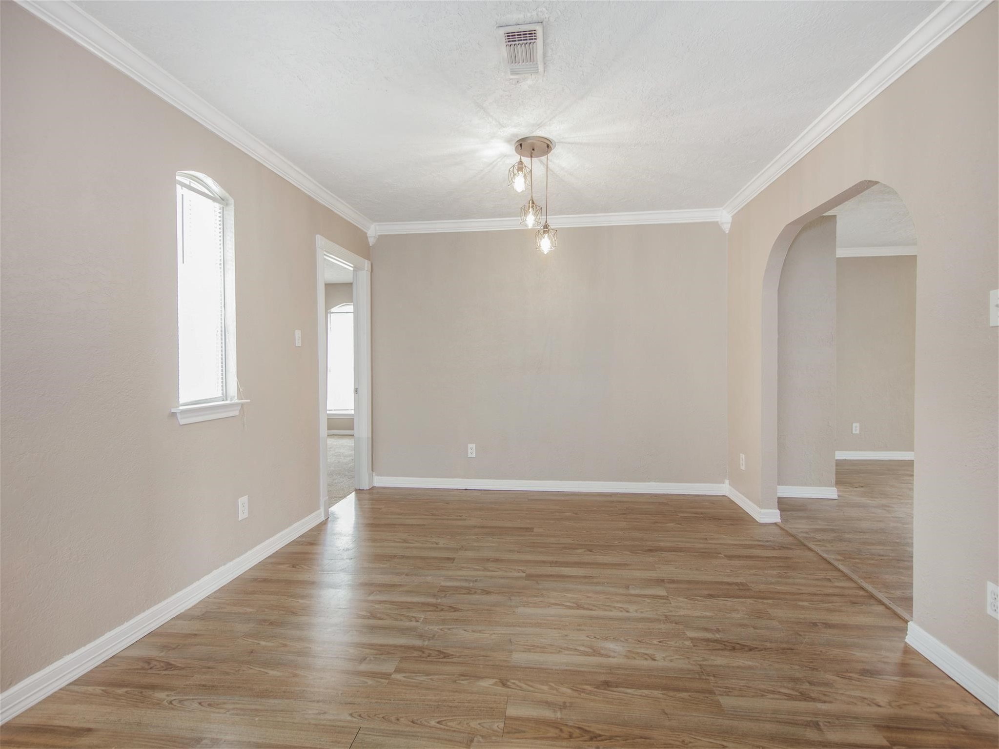 5108 Clay Street Houston, TX 77023 - Photo 10 of 21 wooden floor in an empty room with a window