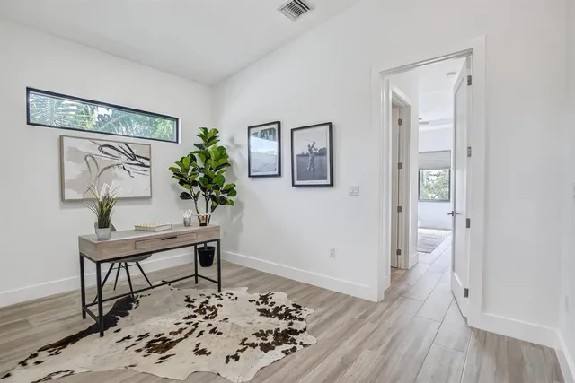 a workspace with furniture and wooden floor