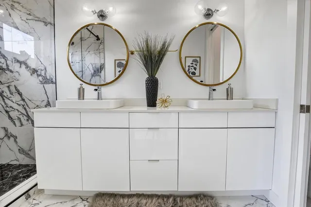 a bathroom with a sink and a mirror