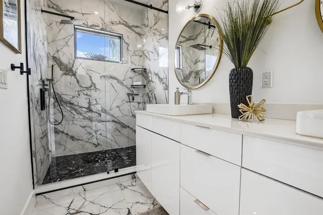 a bathroom with a sink and a mirror
