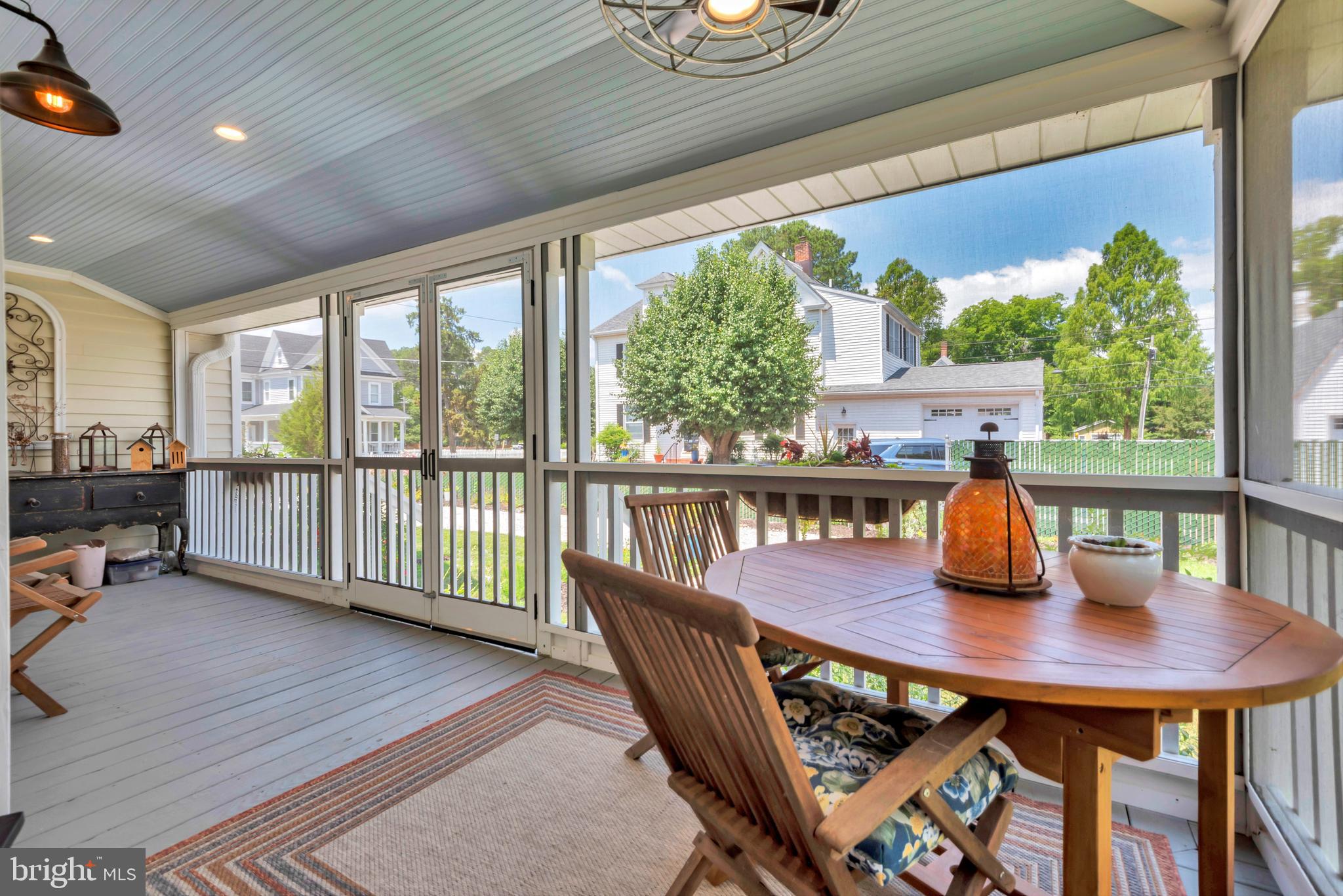 1109 Locust Street Cambridge, MD 21613 - Photo 6 of 67 Screen wrap around porch- 2 ceiling fans