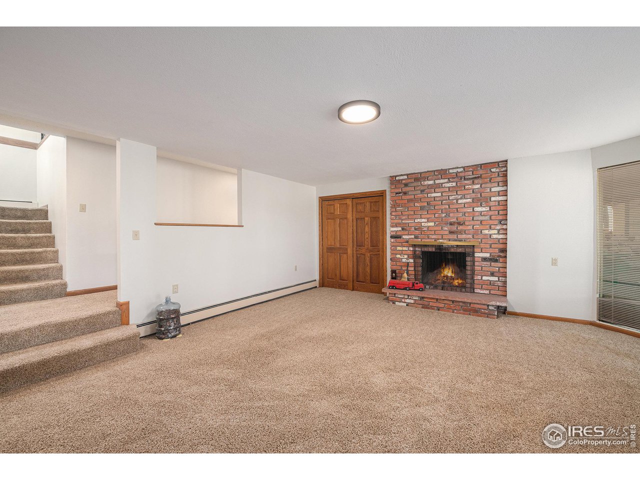 427 Goose Hollow Road Berthoud, CO 80513 - Photo 25 of 40 Basement Family Room with Gas Fireplace