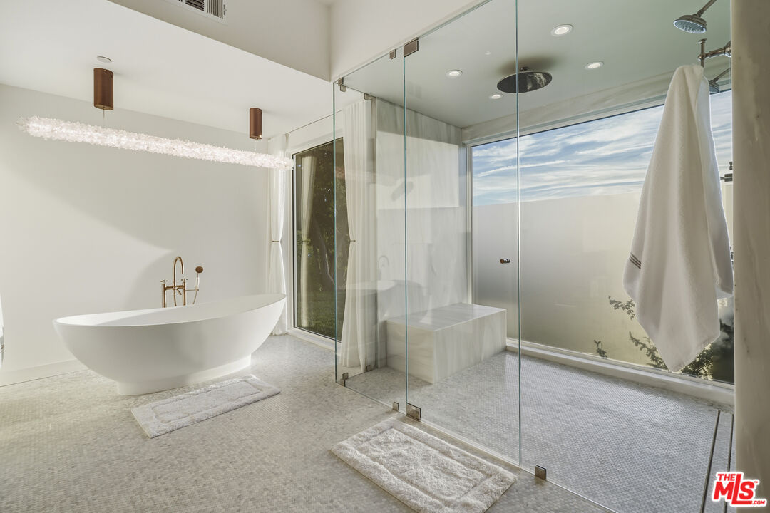 3140 Sweetwater Mesa Road Malibu, CA 90265 - Photo 39 of 71 a spacious bathroom with a bathtub and a shower
