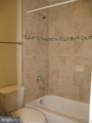 2617 Weisman Road Silver Spring, MD 20902 - Photo 14 of 25 a bathroom with a toilet and a shower