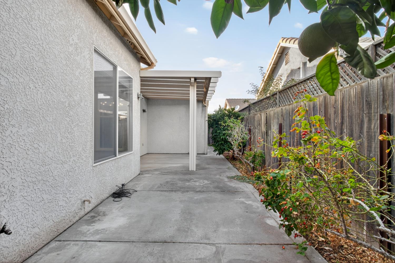 3409 Sugar Oak Court Modesto, CA 95355 - Photo 26 of 28 a view of entryway with flower pots