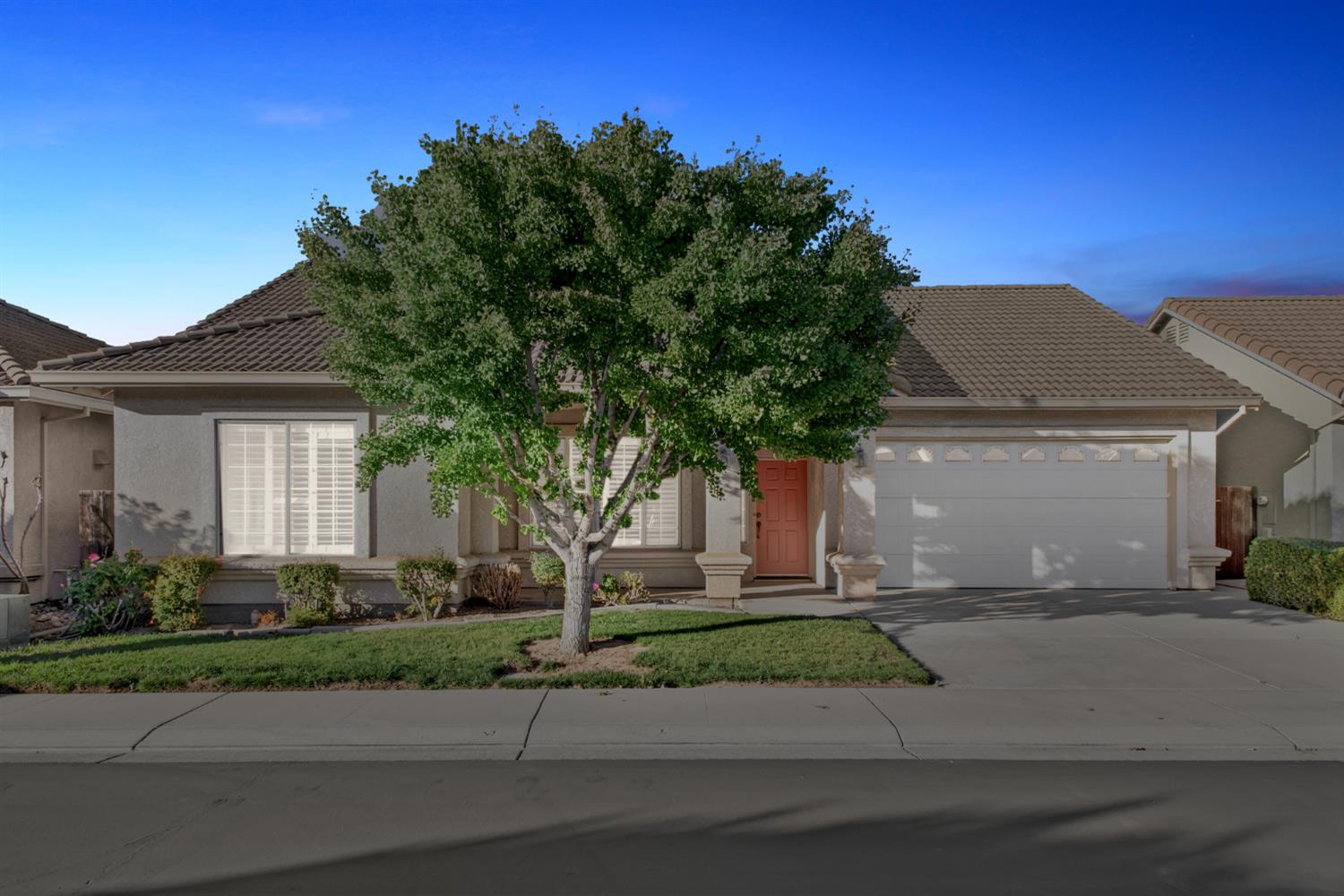 3409 Sugar Oak Court Modesto, CA 95355 - Photo 28 of 28 a front view of a house with a yard and a garage