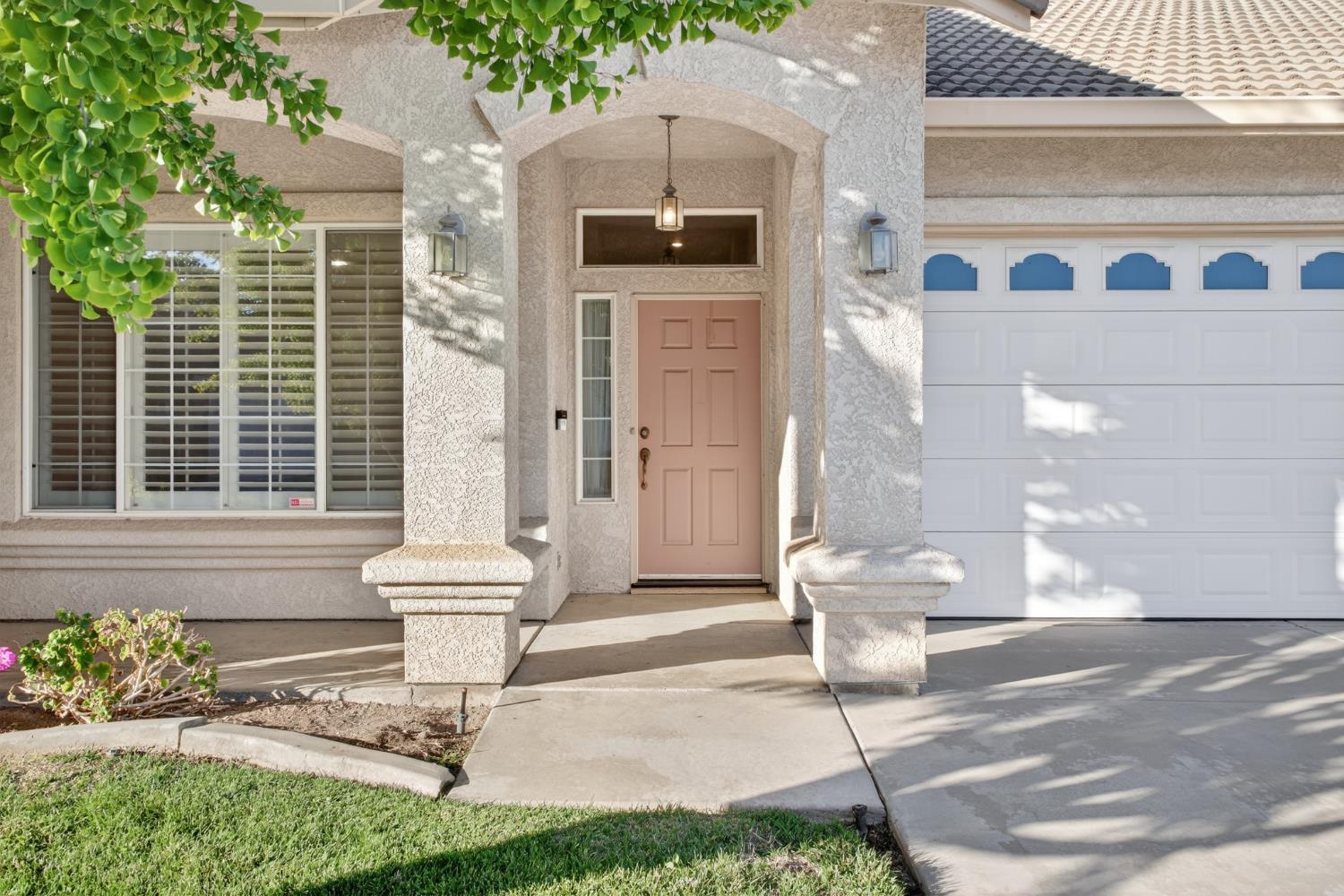 3409 Sugar Oak Court Modesto, CA 95355 - Photo 3 of 28 a front view of a house with outdoor space