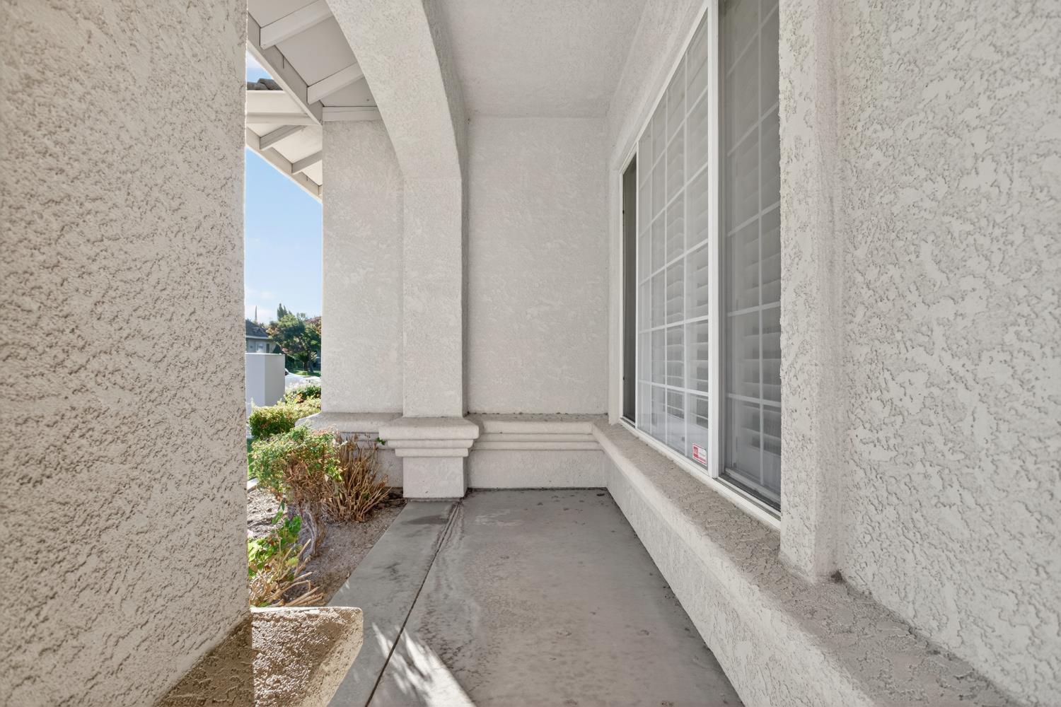 3409 Sugar Oak Court Modesto, CA 95355 - Photo 5 of 28 a large white room with potted plants