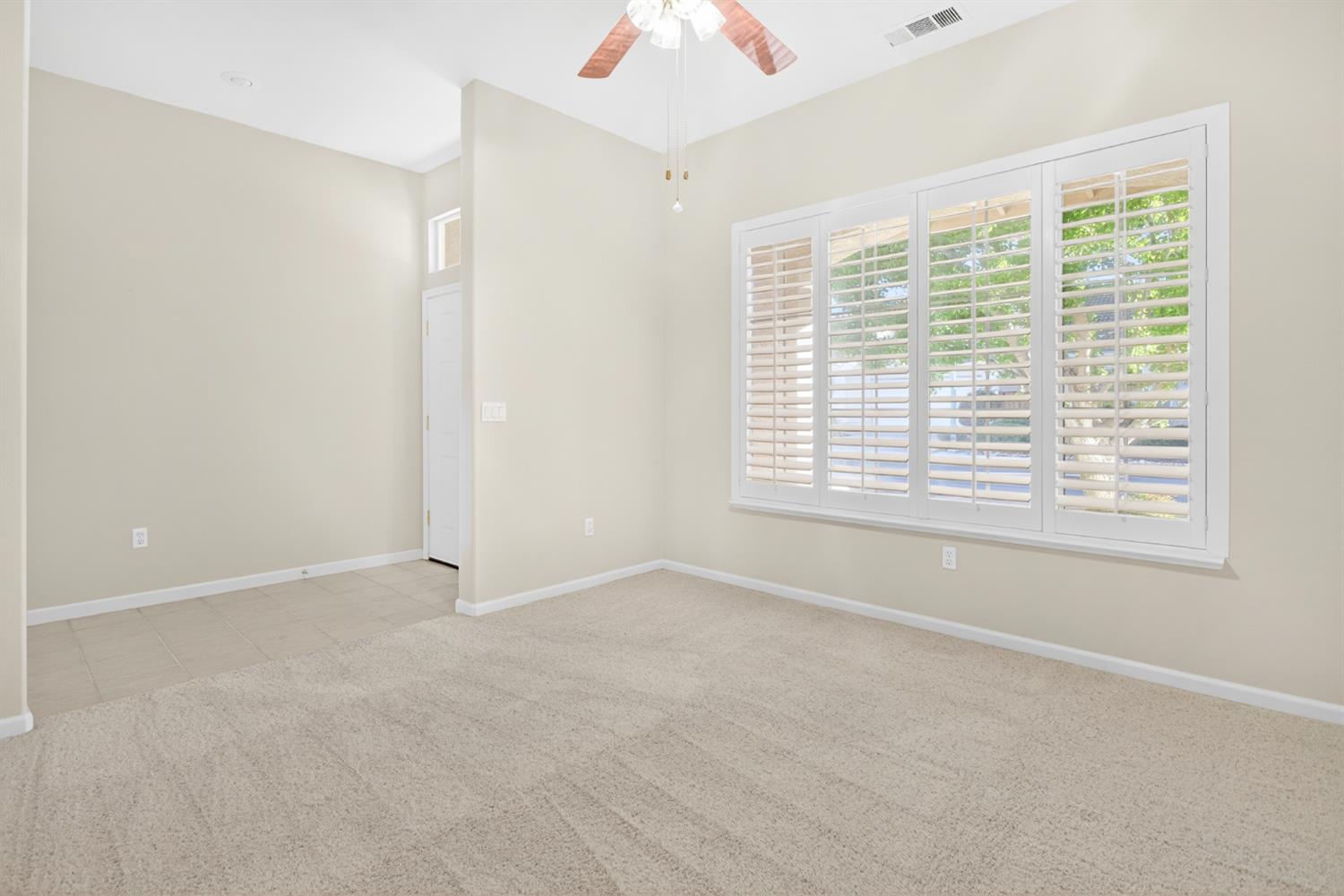 3409 Sugar Oak Court Modesto, CA 95355 - Photo 6 of 28 a view of an empty room with a window