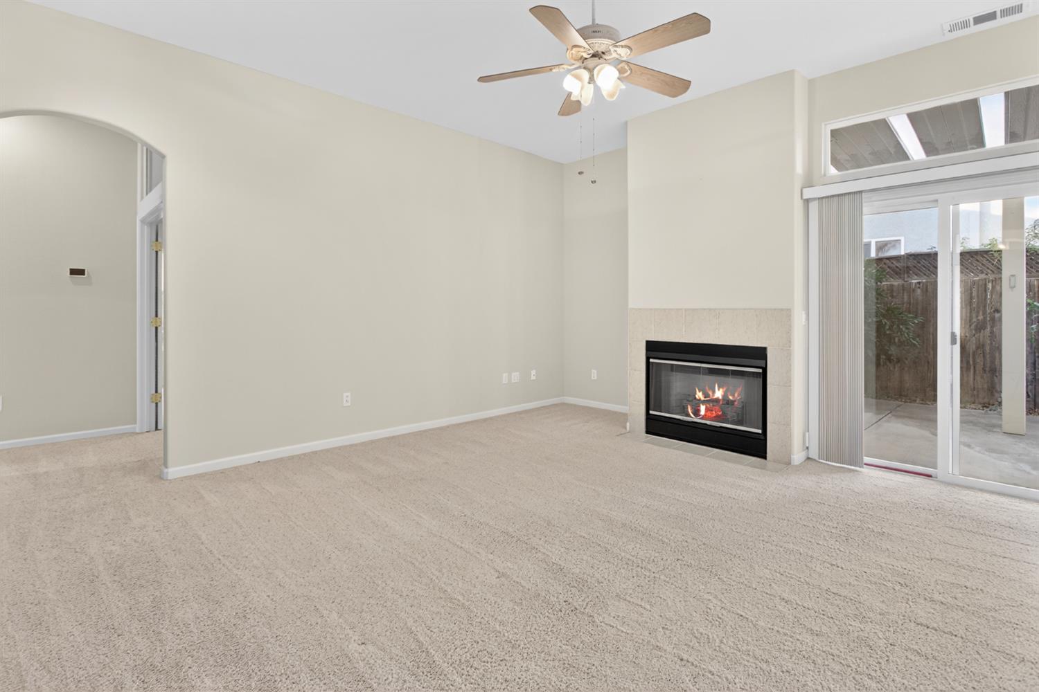 3409 Sugar Oak Court Modesto, CA 95355 - Photo 8 of 28 a view of an empty room with a fireplace