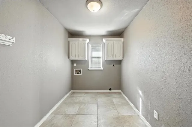 a view of a livingroom with wooden floor and a window