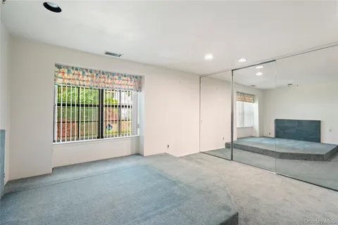 a view of an house with backyard space and garden