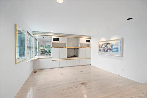 wooden floor with a potted plant on a dresser