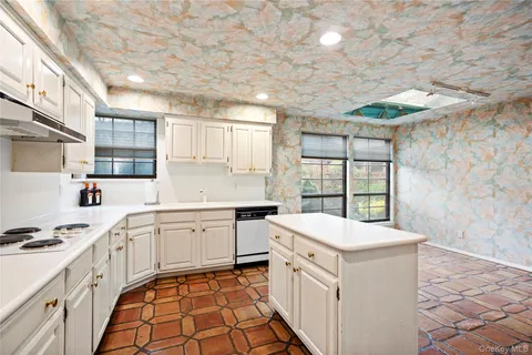 a bathroom with a double vanity sink mirror and toilet