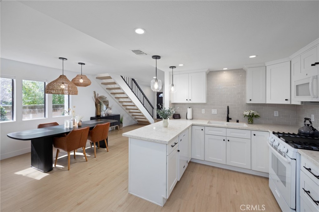 910 Ocean View Avenue, Unit E Monrovia, CA 91016 - Photo 15 of 39 a open kitchen with sink stove and cabinets