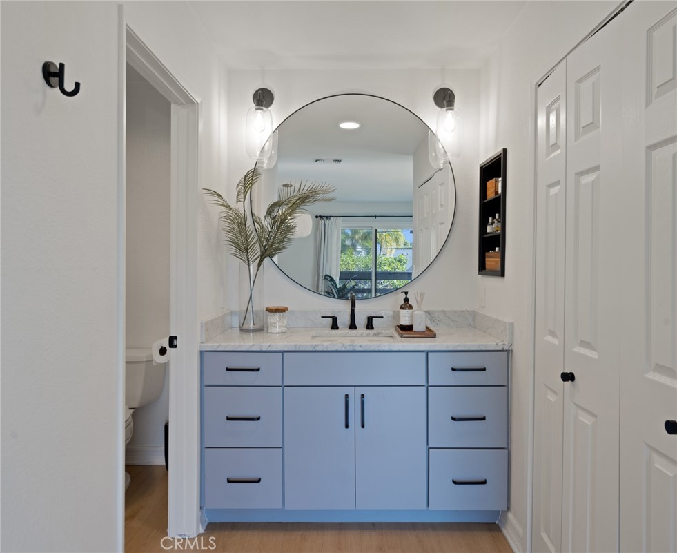 910 Ocean View Avenue, Unit E Monrovia, CA 91016 - Photo 22 of 39 a bathroom with a double vanity sink and a mirror
