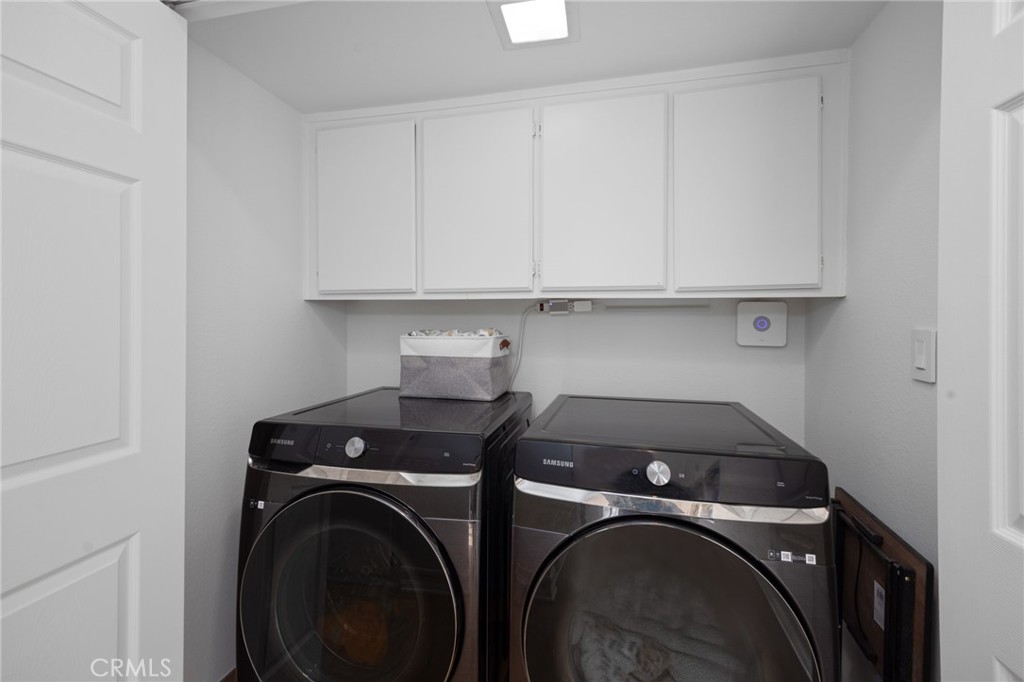 910 Ocean View Avenue, Unit E Monrovia, CA 91016 - Photo 24 of 39 a view of storage and utility room with washer and dryer
