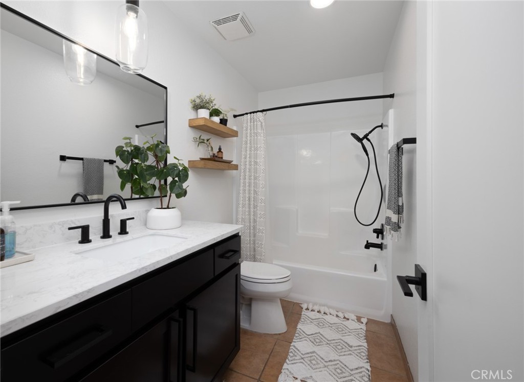 910 Ocean View Avenue, Unit E Monrovia, CA 91016 - Photo 25 of 39 a bathroom with a double vanity sink toilet and shower