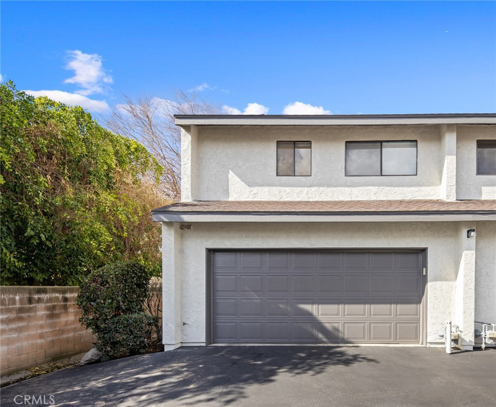 910 Ocean View Avenue, Unit E Monrovia, CA 91016 - Photo 30 of 39 a view of a house with a garage and balcony