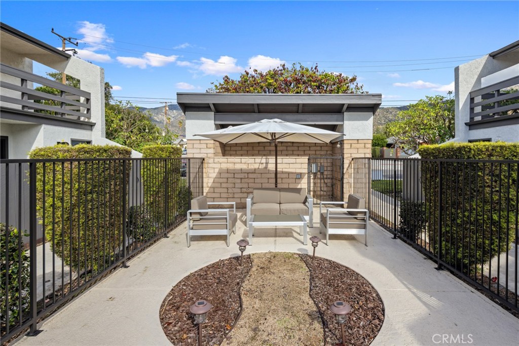 910 Ocean View Avenue, Unit E Monrovia, CA 91016 - Photo 39 of 39 a view of a house with backyard and sitting area
