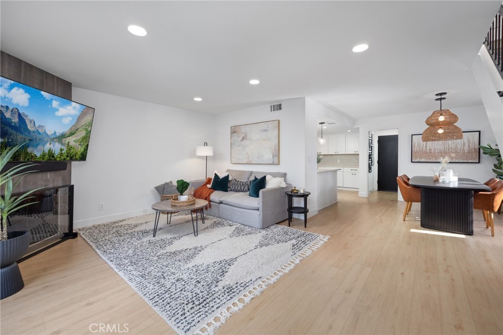 910 Ocean View Avenue, Unit E Monrovia, CA 91016 - Photo 6 of 39 a living room with furniture and a flat screen tv