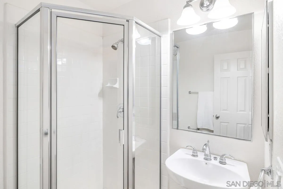 2842 Farragut Road, Unit 131 San Diego, CA 92106 - Photo 22 of 41 a bathroom with a sink and a mirror
