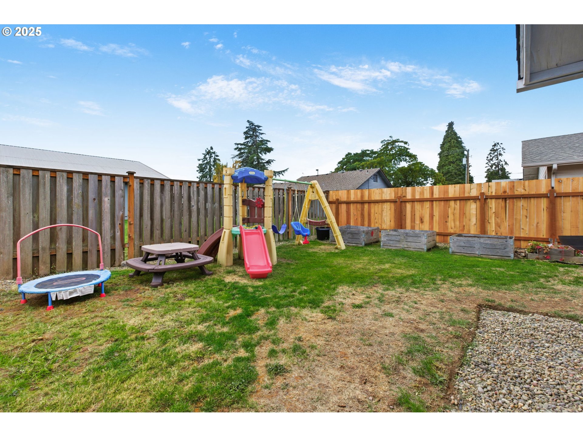 5419 E Street Springfield, OR 97478 - Photo 32 of 37 a backyard of a house with table and chairs