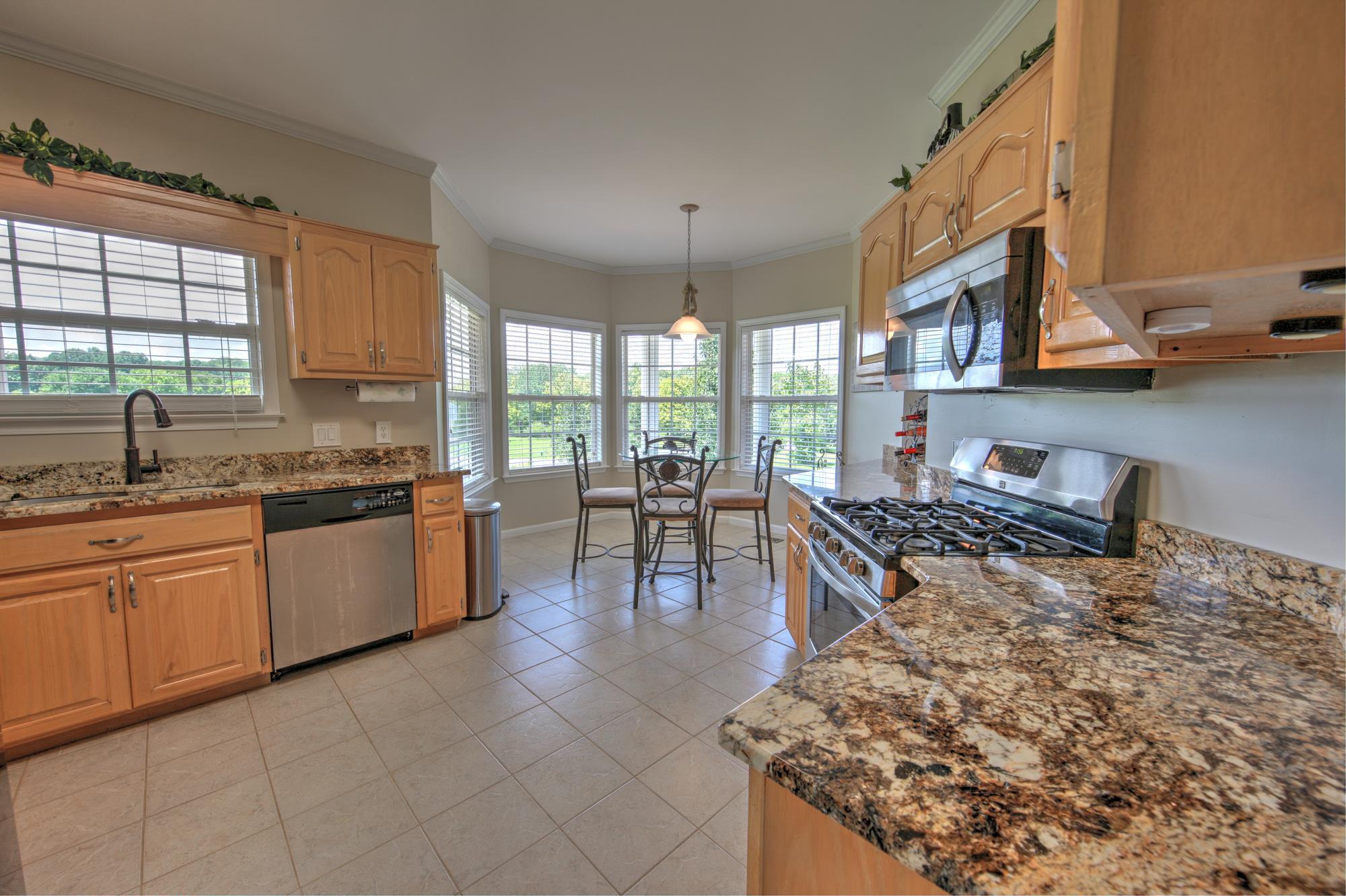 216 Red Oak Trail Spring Hill, TN 37174 - Photo 8 of 24 Granite Counters & Stainless Steel Appliances